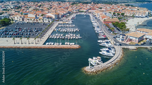 Aerial top view of boats and yachts in marina from above, harbor of Meze town, South France 