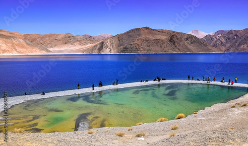 Scenic Pangong Tso lake at Ladakh India with tourists. photo