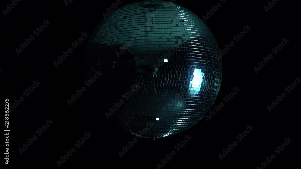 Disco mirror ball at black background with glares Disco mirror ball at black background with glares
