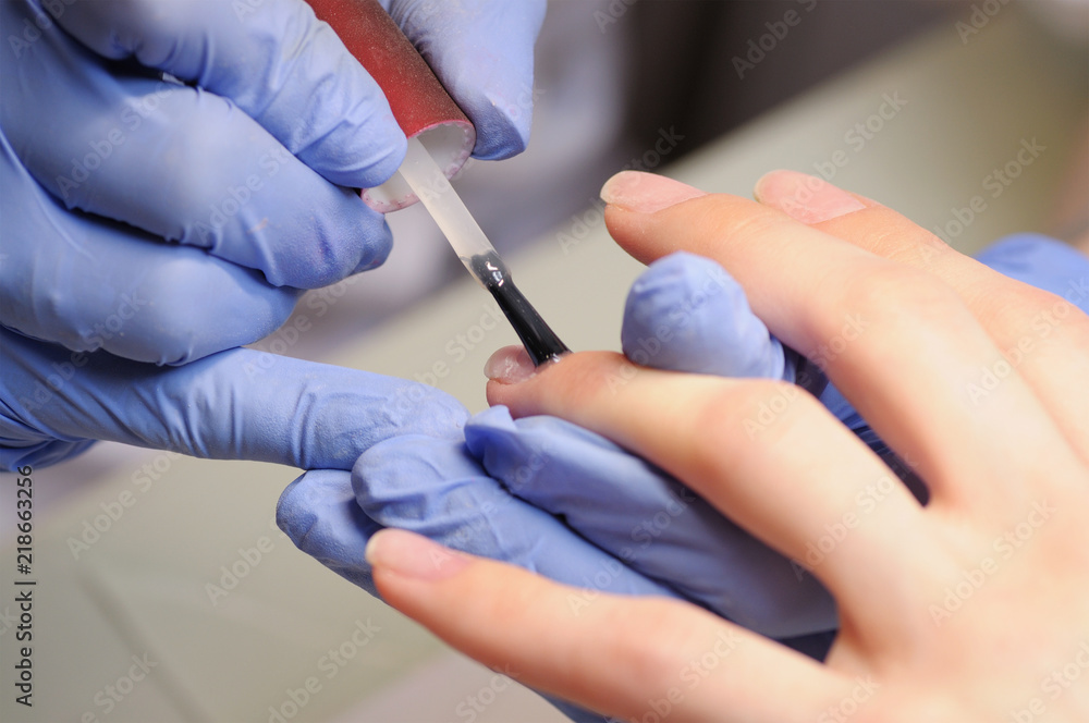 Professional manicure process in beauty salon. Professional manicure process in beauty salon.