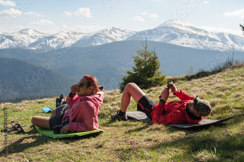 travelers who are resting in the mountains