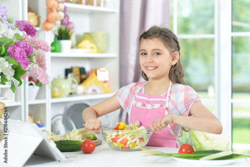 Portrait of cute little girl making dinner Portrait of cute little girl making dinner