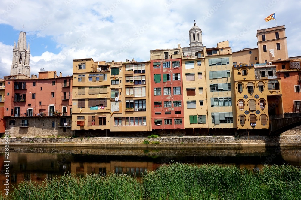 Multicolored old houses on the embankment of the river Onyar in the Catalan town of Girona