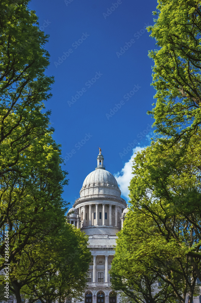 Rhode Island State House between Trees against Blue Sky
