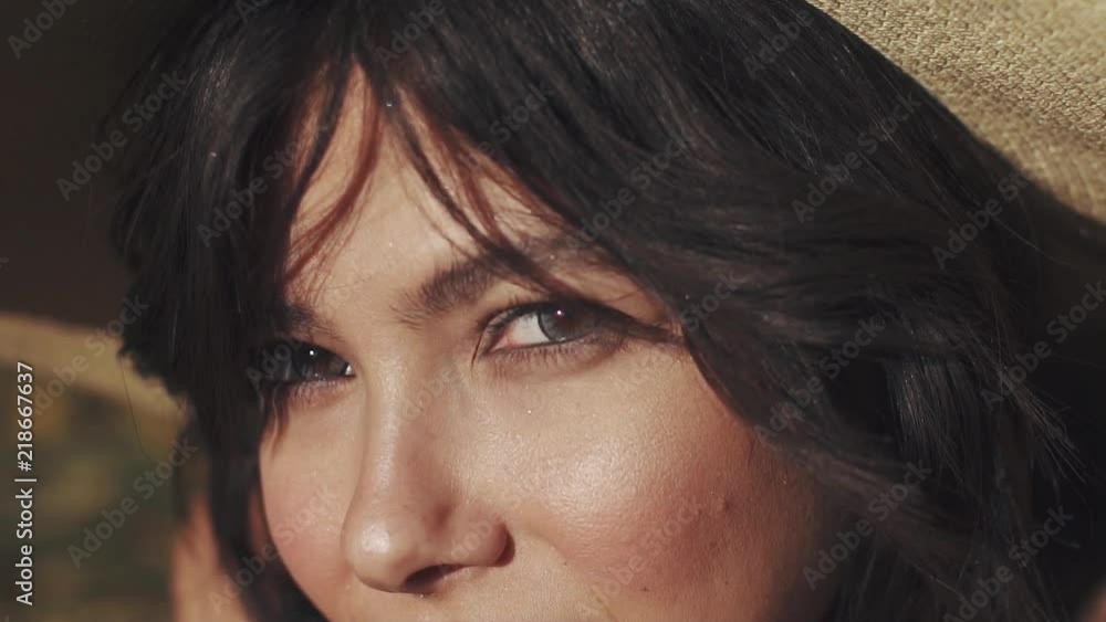 female eyes close-up. Mysterious and attractive look of a young girl who looks at the camera female eyes close-up. Mysterious and attractive look of a young girl who looks at the camera