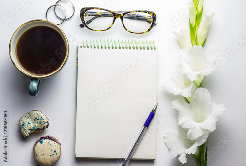Stylized feminine flatlay with glasses, lipstick, and tablet mock up isolated on white top view.