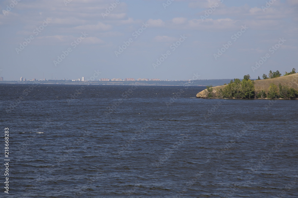 Panorama of the city from the bank of the river in summer. Russia.