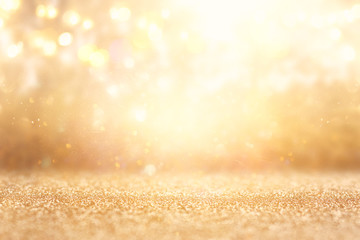 glitter vintage lights background. silver and gold. de-focused.