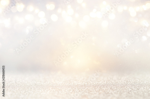 glitter vintage lights background. silver and light gold. de-focused. © tomertu