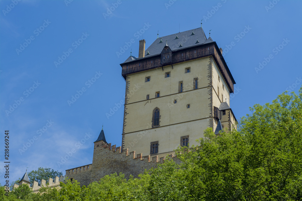 The tower of the old castle Karlstein in the forest The tower of the old castle Karlstein in the forest