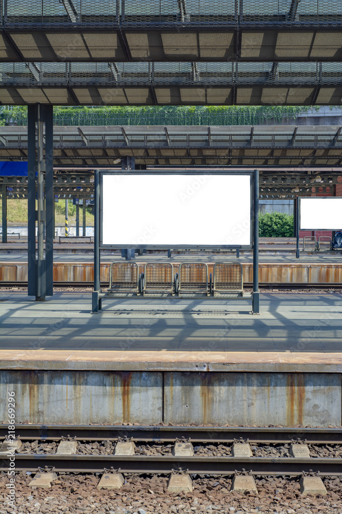 Platform of the railway station with empty board Platform of the railway station with empty board