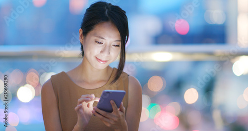 Photography Woman use of mobile phone for online at night