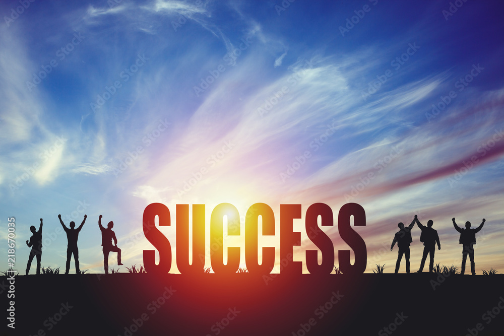 Silhouette of happy business team making high hands in sunset sky background