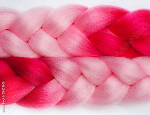 Canvas-taulu Two beautiful pink kanekalon on white background close-up.
