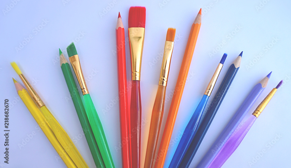 Color pencils and same color paint brushes, stuff for new primary school year activities