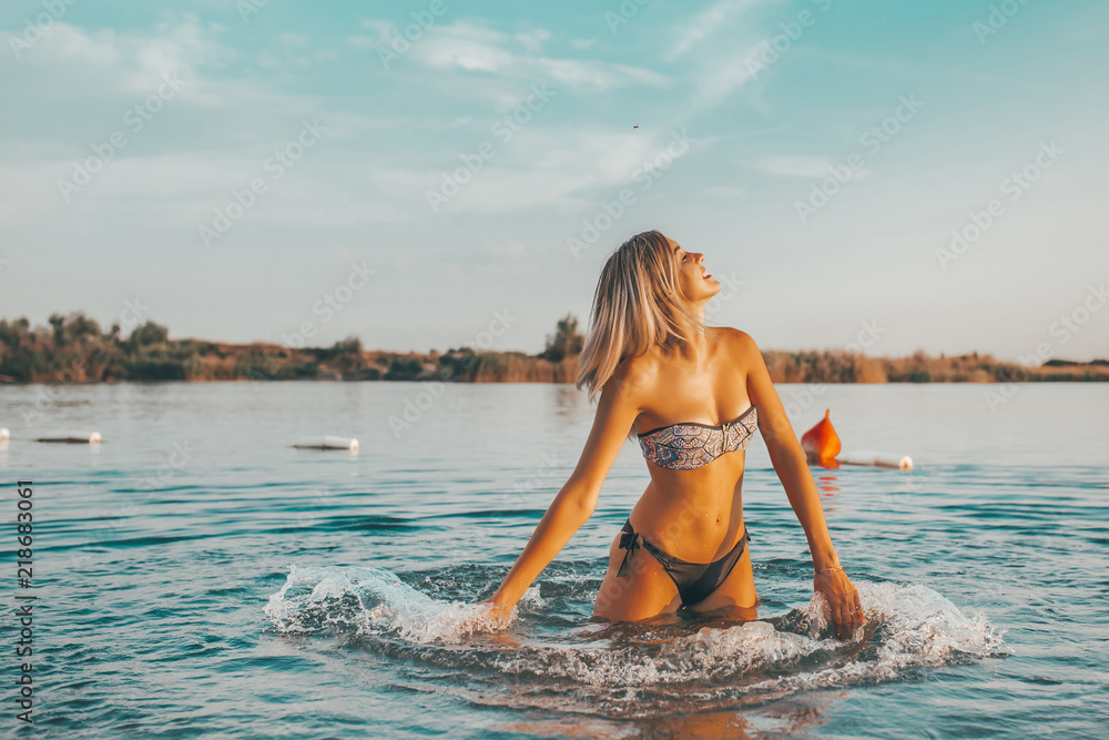 Beautiful girl having fun in water Beautiful girl having fun in water