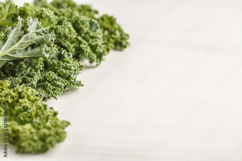 Fresh green leaves of kale on white background. Fresh green leaves of kale on white background.