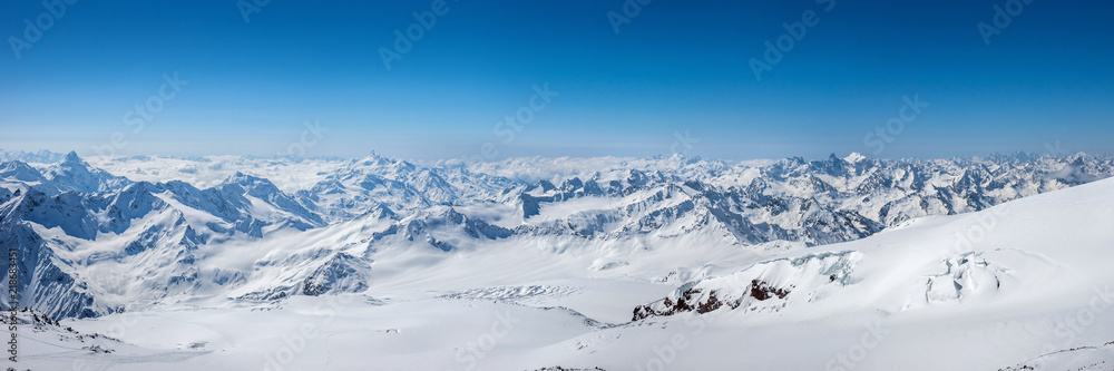 Greater Caucasus mountains at winter sunny day. View from Pastuchova kliffs at Elbrus ski slope, Kabardino-Balkaria, Russia