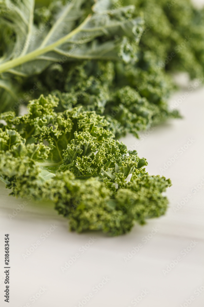 Fresh green leaves of kale on white background. Fresh green leaves of kale on white background.