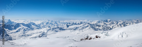 Greater Caucasus mountains at winter sunny day. View from Pastuchova kliffs at Elbrus ski slope, Kabardino-Balkaria, Russia