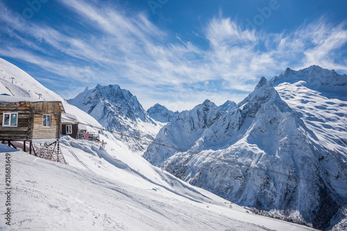 An old soviet cable car termina on a ski slope in winter sunny day. Dombay ski resort, Karachai-Cherkess, Western Caucasus, Russia.