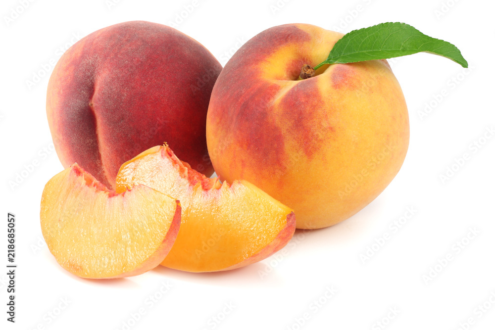 peach fruit with green leaf and slices isolated on white background