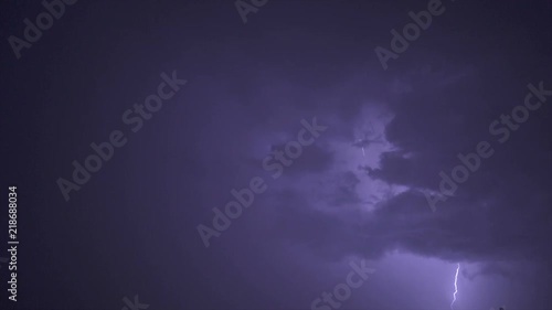 The picturesque thunderstorm with lightning in the night sky. slow motion photo