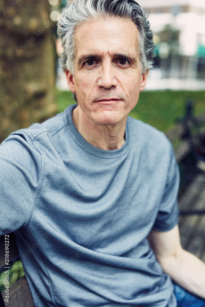 Grey Haired Man Sits on Park Bench Grey Haired Man Sits on Park Bench