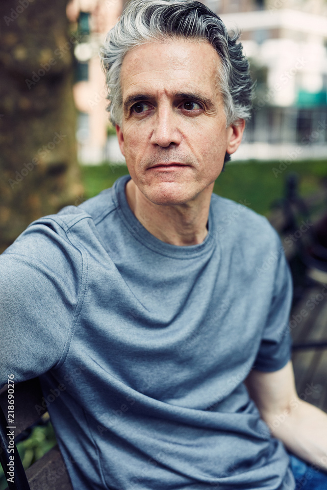 Grey Haired Man Sits on Park Bench Grey Haired Man Sits on Park Bench