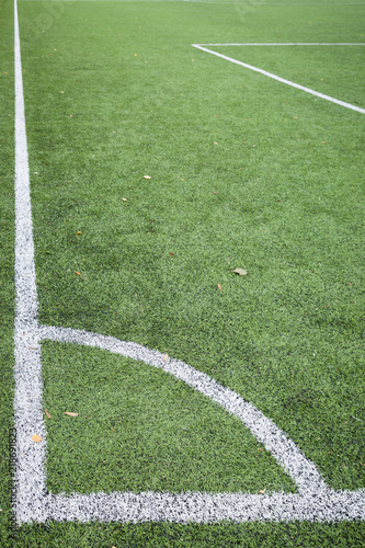 Closeup of Corner kick line of football and soccer field, background texture © goodmoments