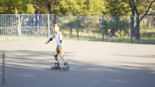 Wallpaper Mural Little boy, seven years old, scatting downhill Torontodigital.ca
