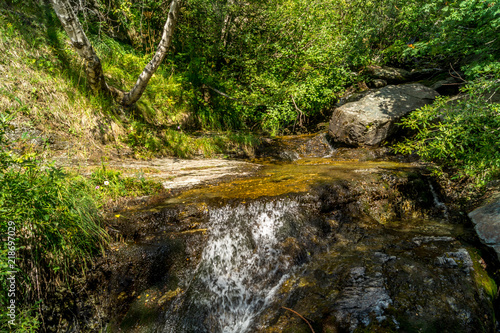 waterfall in the mountains among the rocks