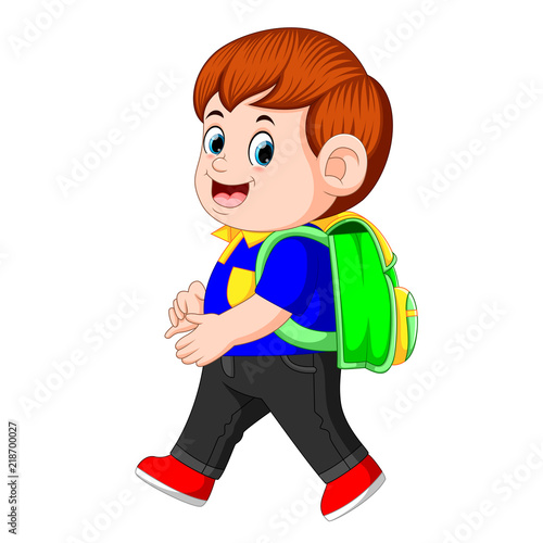 a schoolboy with backpacks walking with smile
