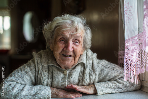 Portrait of cheerful elderly woman.
