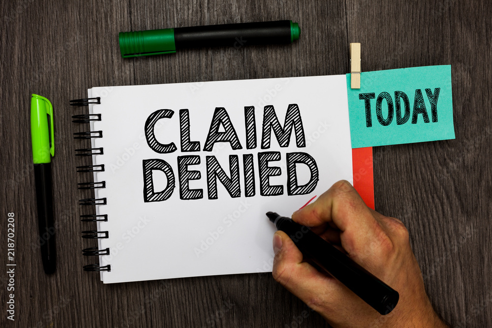 Conceptual hand writing showing Claim Denied. Business photo showcasing Requested reimbursement payment for bill has been refused Man holding marker notebook reminder cup markers wood table. Conceptual hand writing showing Claim Denied. Business photo showcasing Requested reimbursement payment for bill has been refused Man holding marker notebook reminder cup markers wood table.