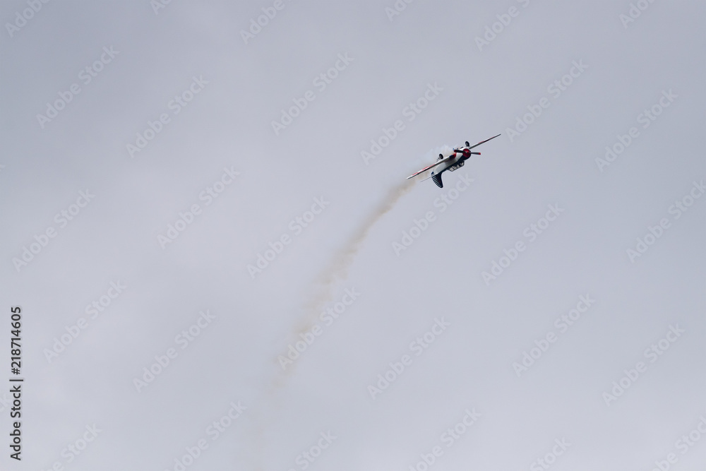 Yak-52 aircraft in the sky performs the program at the air show Yak-52 aircraft in the sky performs the program at the air show