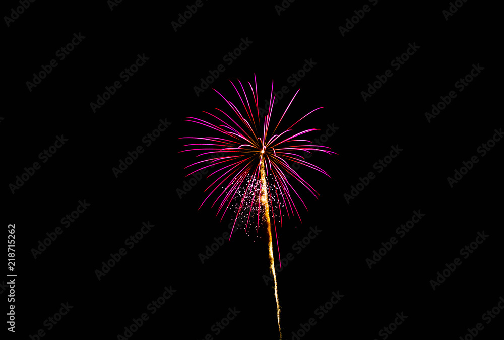 Purple firework exploding with trail Purple firework exploding with trail