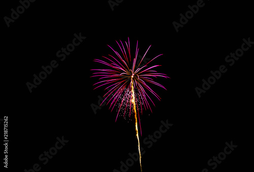 Purple firework exploding with trail