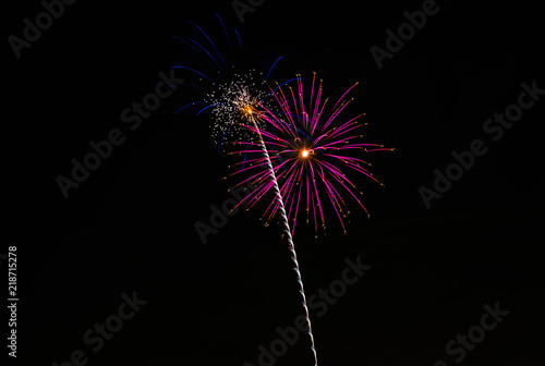 Purple firework exploding with star trail