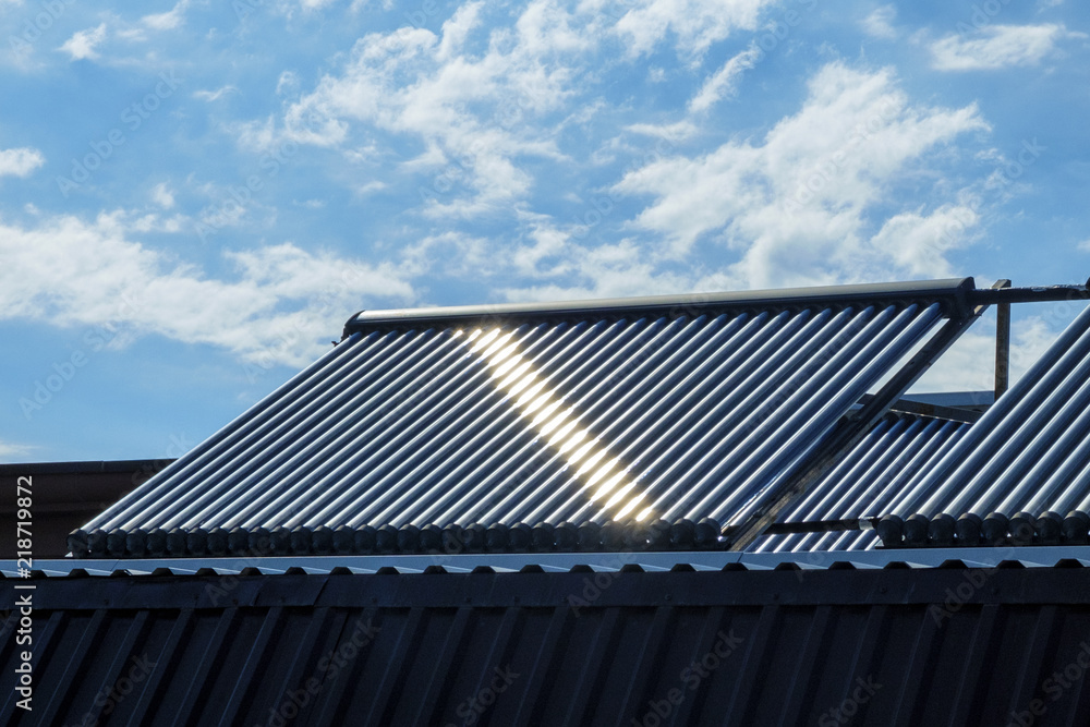 Vacuum solar water heating system on the house roof. Vacuum solar water heating system on the house roof.