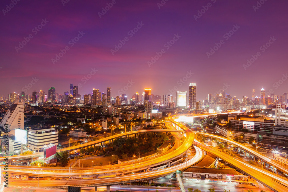 Bangkok skylines and highway traffic motion of urban in the sunset to night.