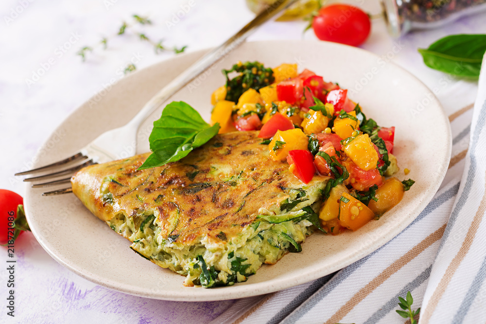 Frittata with zucchini, cheese, basil and salsa from tomatoes. Useful breakfast. Italian omelette. Frittata with zucchini, cheese, basil and salsa from tomatoes. Useful breakfast. Italian omelette.