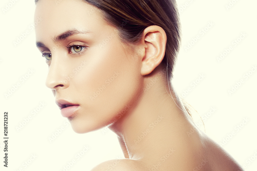 Fototapeta premium Beautiful young caucasian girl with natural makeup profile. Woman portrait. Toned image