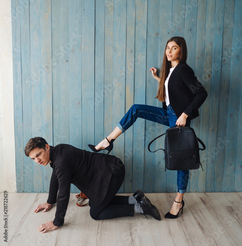 Photos The girl put her foot on the guy's back