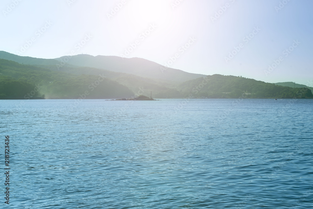 Defocus Sea landscape hills horizon sky fog nature saturated. Defocus Sea landscape hills horizon sky fog nature saturated.
