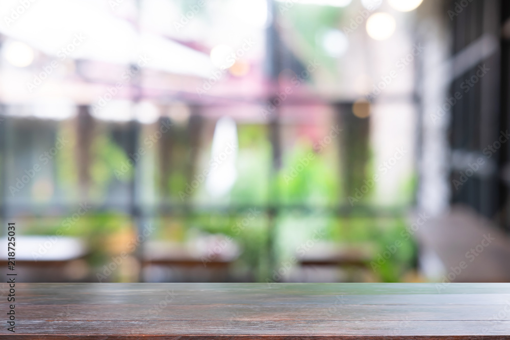 Empty wooden table on cafe blur background. Empty wooden table on cafe blur background.