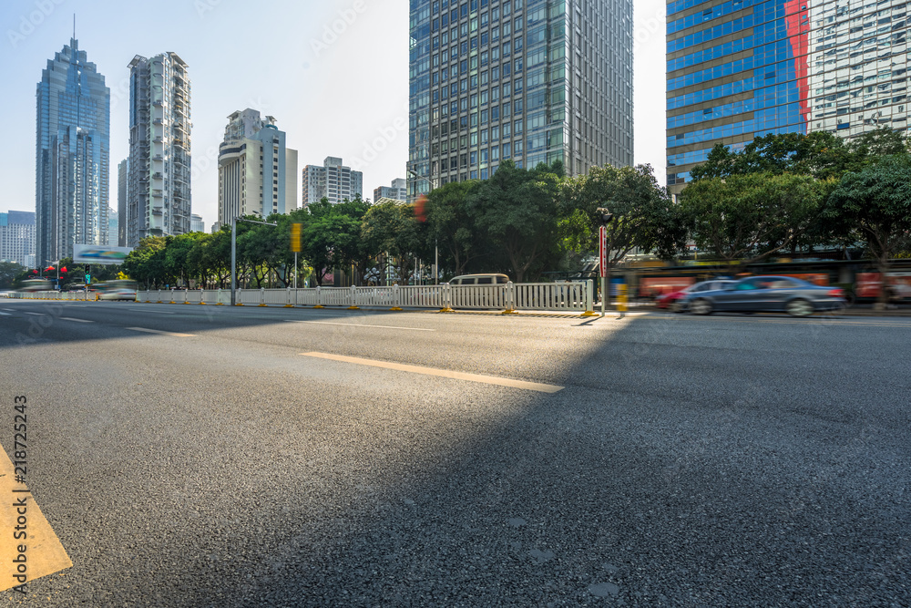 Fototapeta premium empty road and modern office block buildings against sky, china