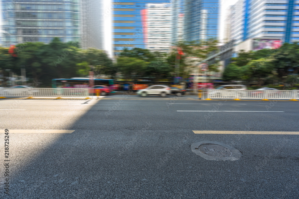 empty road and modern office block buildings against sky, china empty road and modern office block buildings against sky, china