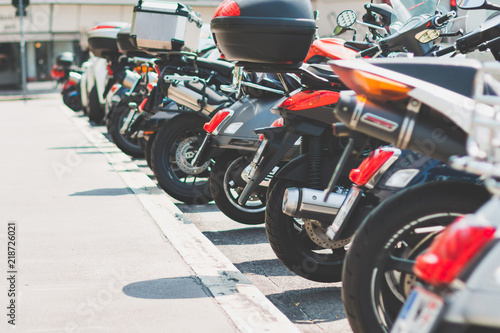 Scooters in a row in a city parking lot
