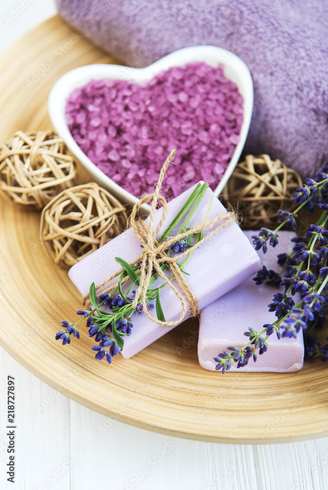 Heart-shaped bowl with sea salt, soap and fresh lavender flowers Heart-shaped bowl with sea salt, soap and fresh lavender flowers
